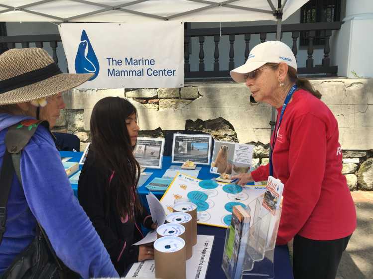 San Luis Obispo volunteer speaking to guests at a conservation education event