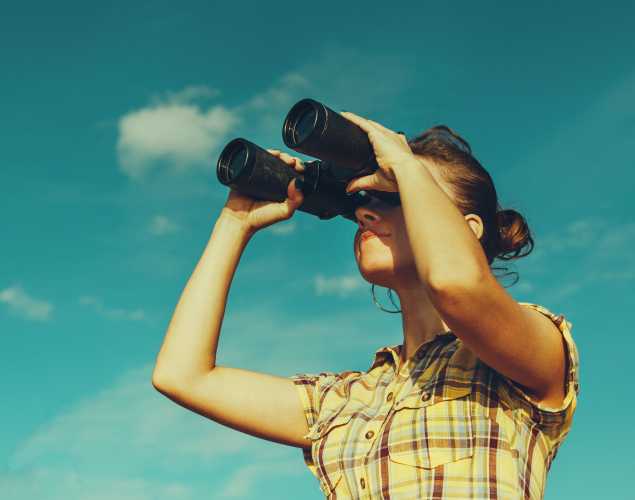 girl with binoculars exploring