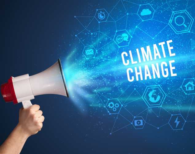hand holding a megaphone with the words "climate change"