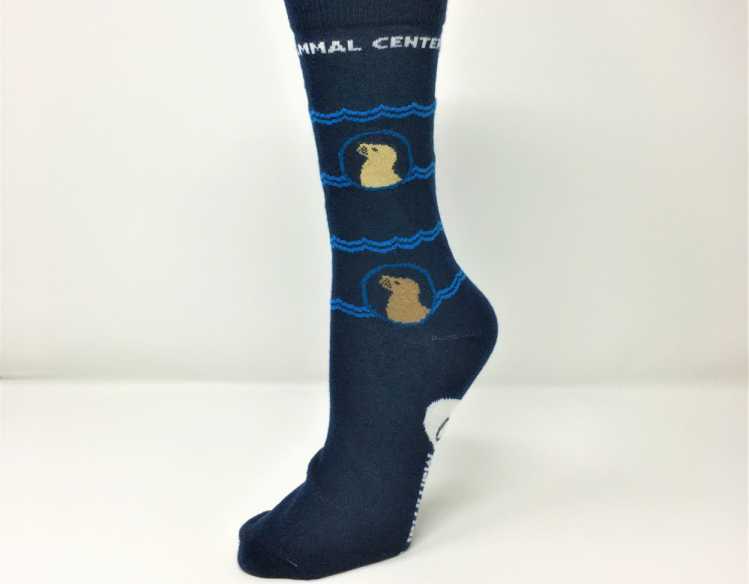 navy socks with sea lions and the words The Marine Mammal Center