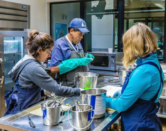 volunteers prepare patient meals in the Fish Kitchen