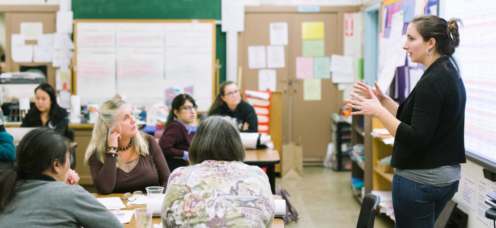 an educator from The Marine Mammal Center speaks to a group of teachers