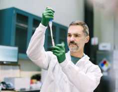 Carlos Rios holding a test tube